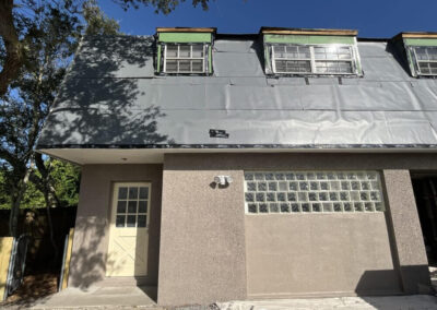 Exterior house painting in St. Augustine, shell surface
