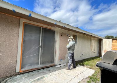 Exterior house textured surface spray painting service in St. Augustine florida