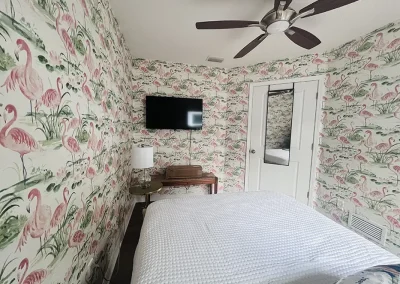 room with flamingo wallpaper